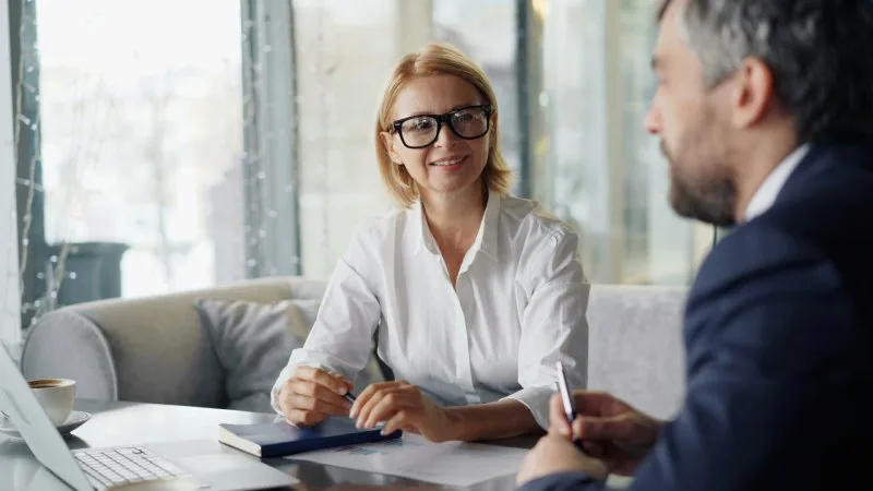Fee-only financial advisor in St. Louis meeting with a client to review their financial plan 