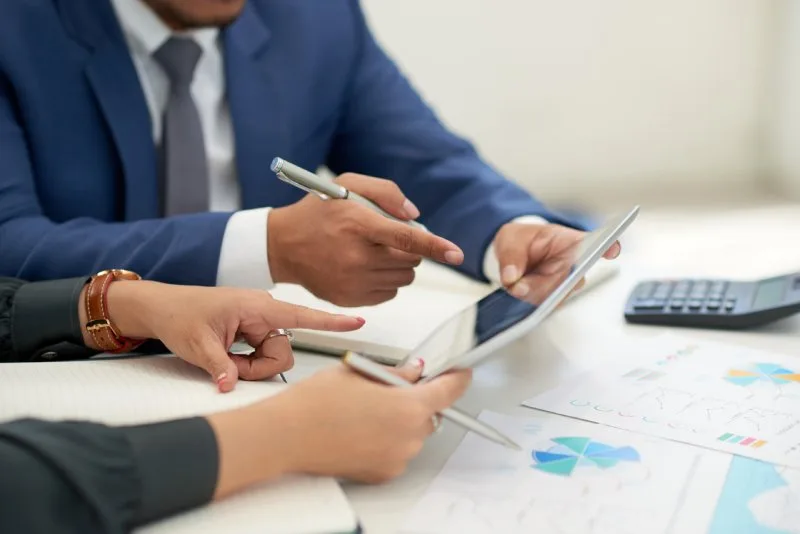 Two fee-only financial advisors in St. Charles reviewing a client financial plan together 
