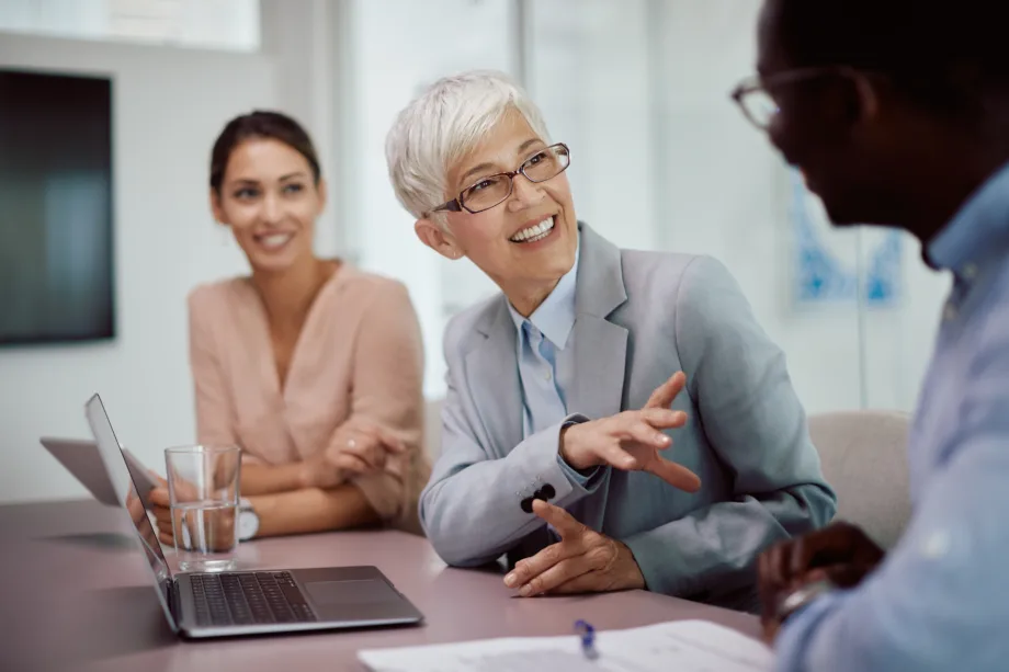 Financial advisor meeting with clients to discuss planning and investment decisions.